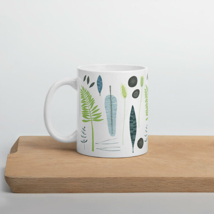 Cốc sứ họa tiết hình lá, đá và lông vũ